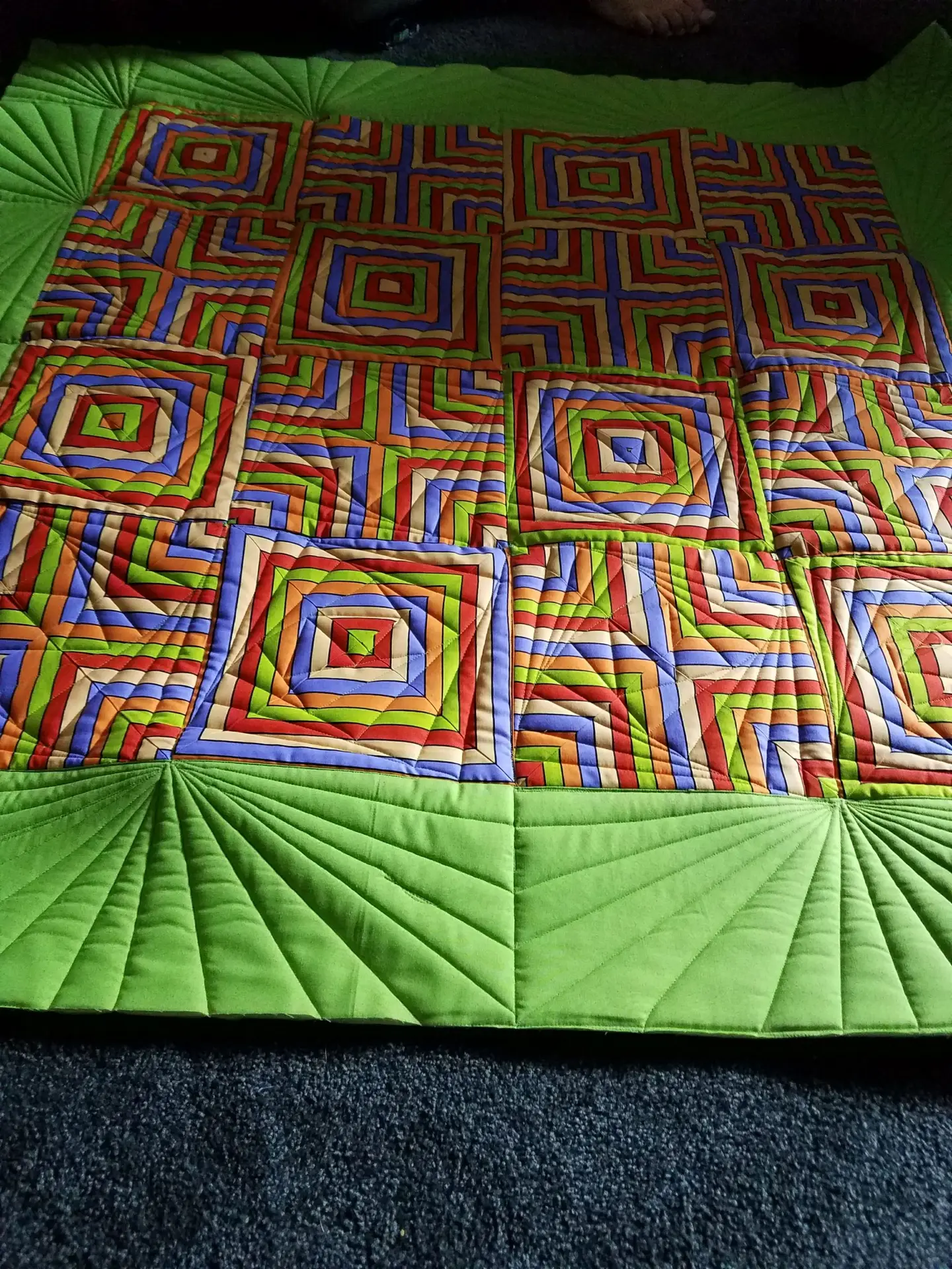 Ruler based free motion longarm quilting by Spencer Hatman in upstate New York, featuring precision stitching on one of Spencer's quilts
