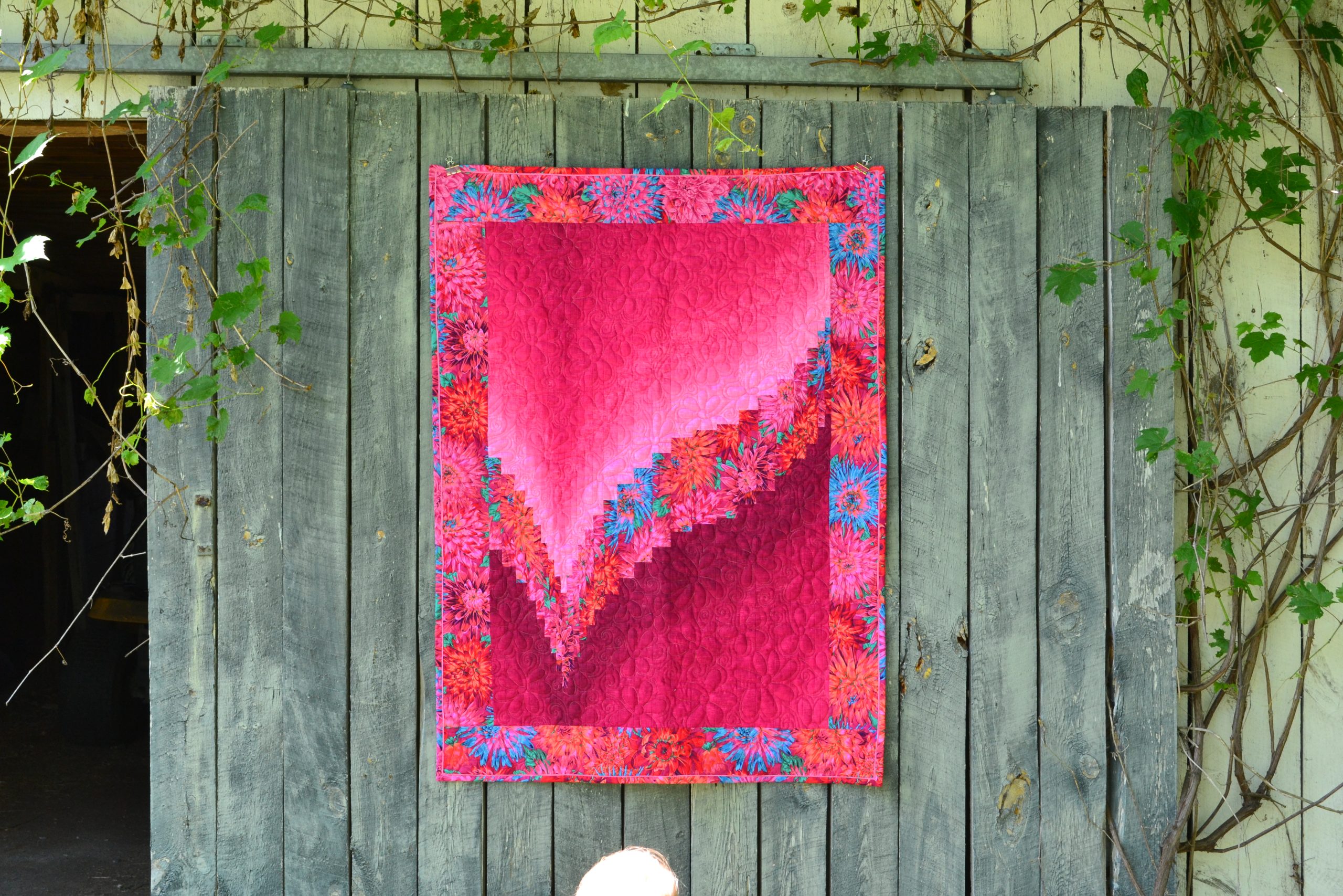 Free motion longarm quilting by Spencer Hatman in upstate New York, featuring precision stitching on one of Spencer's quilts