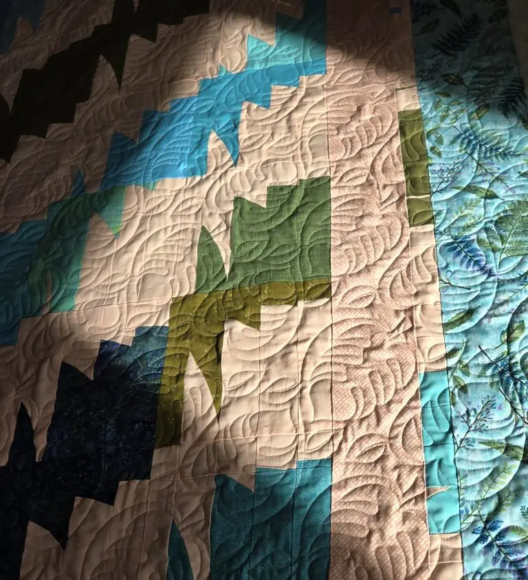 Computerized edge to edge longarm quilting by Spencer Hatman in upstate New York, featuring precision stitching on a customer quilt