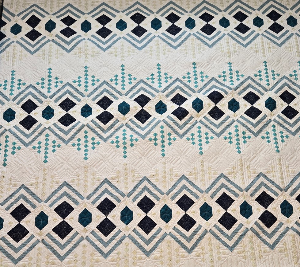 Computerized custom longarm quilting by Spencer Hatman in upstate New York, featuring precision stitching on one of Spencer's quilts