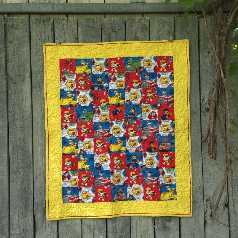 Computerized edge to edge longarm quilting by Spencer Hatman in upstate New York, featuring precision stitching on one of Spencer's quilts