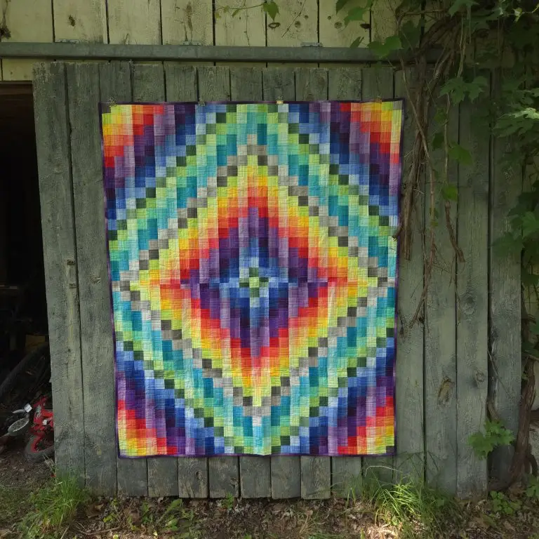 Computerized edge to edge longarm quilting by Spencer Hatman in upstate New York, featuring precision stitching on one of Spencer's quilts